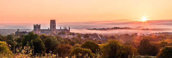 The view of the Durham Cathedral in the sunrise and mist from the Observatory Hill