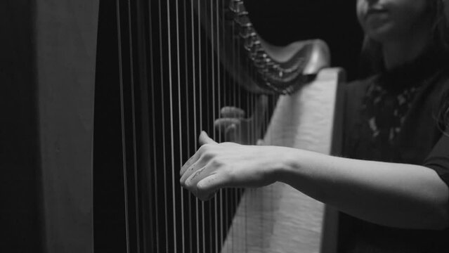 Woman Playing Harp in Black and White and Slow Motion