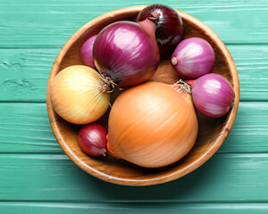 Bowl with different onions on color wooden table MADE OF AI 