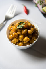 Healthy food Chickpea masala in a bowl served. Close up, selective focus.