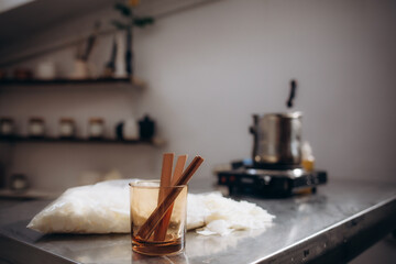 Wooden wick for candle making at the table. Making homemade candle. Crackling wick.