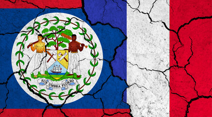 Flags of Belize and France on cracked surface - politics, relationship concept