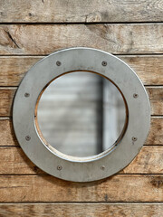 Porthole of a wooden ship boat