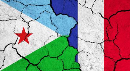 Flags of Djibouti and France on cracked surface - politics, relationship concept