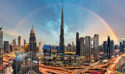 Foto op Canvas Rainbow over Skyline of Dubai bussines downtown at sunrise, United Arab Emirates © TTstudio
