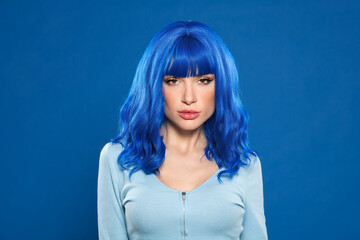 Fototapeta premium Attractive female model with blue hair