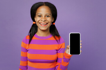 Little kid teen girl of African American ethnicity 15 years old wear striped orange sweatshirt hold...
