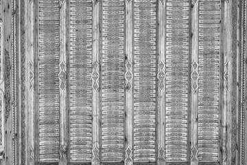 Fragment of an ancient carved wooden pattern. Ornate. Abstract background. Black and white.