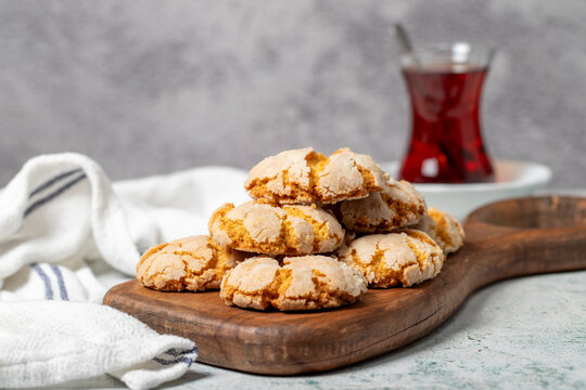 Orange cookies. Cracked delicious cookies on wood serving board