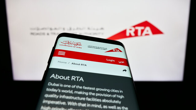 Stuttgart, Germany - 07-24-2023: Smartphone with webpage of Emirati Roads and Transport Authority (RTA) on screen in front of logo. Focus on top-left of phone display.
