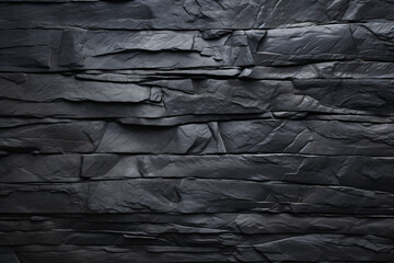 Black slate stone wall texture background. Natural stone pattern for design.