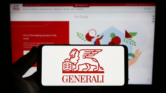 Stuttgart, Germany - 07-25-2023: Person holding smartphone with logo of insurance company Assicurazioni Generali S.p.A. on screen in front of website. Focus on phone display.