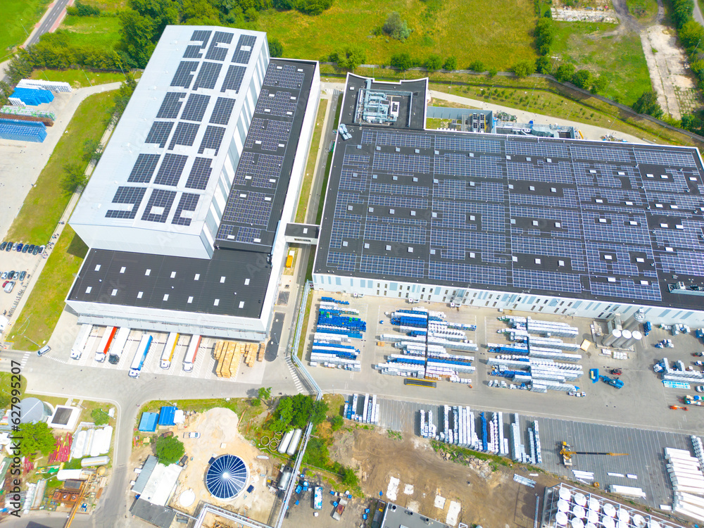 Wall mural aerial view of modern storage warehouse with solar panels on the roof. logistics center in industria