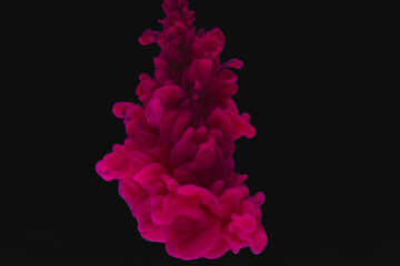 Close up of bright pink ink in water with copy space on black background