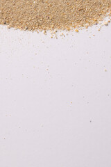 Close up of sand grains and copy space on white background