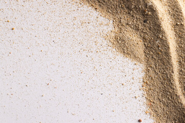 Close up of sand grains and copy space on white background