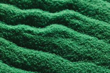Close up of pattern of green sand and copy space background