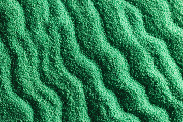 Close up of pattern of green sand and copy space background