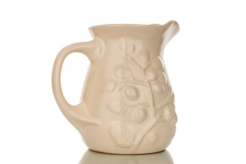 One ceramic jug, macro, isolated on white background.