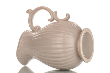 One ceramic jug, macro, isolated on white background.