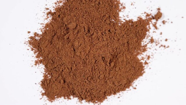  Dried and ground sour grape powder spinning clockwise - shallow depth of field