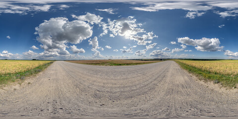 Fototapeta na wymiar 360 hdri panorama on white sand gravel road with clouds on blue sky in equirectangular spherical seamless projection, skydome replacement in drone panoramas and game development or VR content