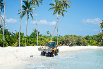 Reclaiming the beach at Siyam World resort, Sun Siyam, Maldives. The sea level rises and the beach is being washed out, construction work in progress - 628014820