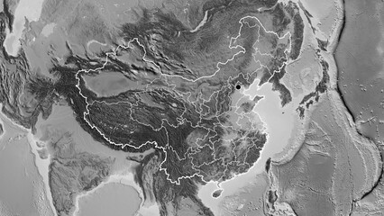 Shape of China with regional borders. Grayscale.