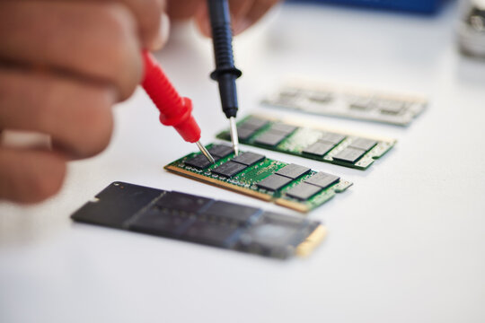 Hands, motherboard and engineer solder circuit board for technology, electrical hardware or CPU microchip. Closeup, technician and iron welding tools for IT maintenance, upgrade or test semiconductor