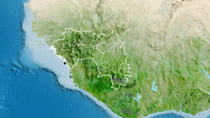 Shape of Guinea with regional borders. Satellite.