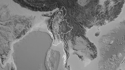 Shape of Myanmar with regional borders. Grayscale.