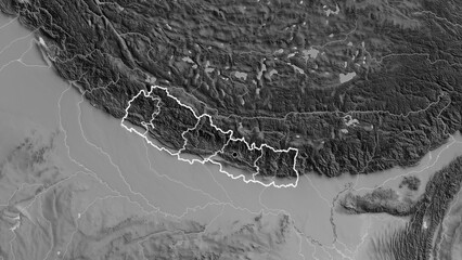 Shape of Nepal with regional borders. Grayscale. © zelwanka