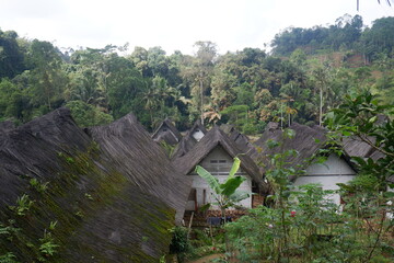 A traditional house with a unique architecture, made of wood and bamboo with a roof of palm fiber in Kampung Naga
