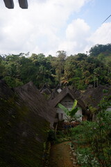 A traditional house with a unique architecture, made of wood and bamboo with a roof of palm fiber in Kampung Naga