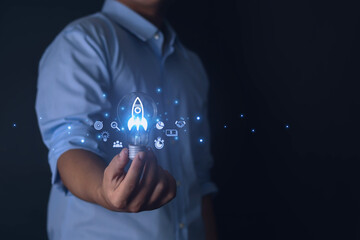 Businessman with icon transparent rocket is launching and flying with network connection icon on modern virtual interface.	
