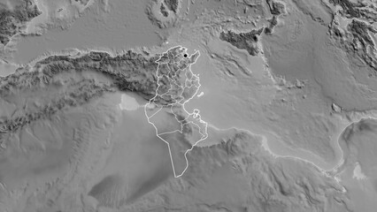 Shape of Tunisia with regional borders. Grayscale. © zelwanka
