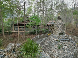 A Buddhist temple in the middle of a forest by the Bamboo Bridge in Pai, Thailand.