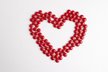 Obraz premium heart made of red medicine pills.