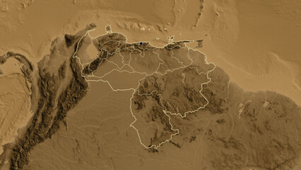 Shape of Venezuela with regional borders. Sepia elevation.