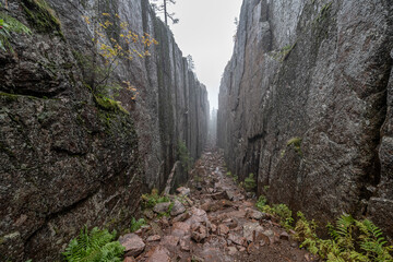 Slattdalsskrevan Canyon in Skuleskogen National Park Narrow crevasse in solid rock Hiking High Coast Trail in Sweden