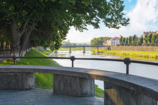 river waterfront at sunrise. cityscape in summer. warm sunny weather. uzhgorod downtown