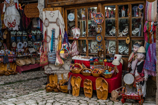 KRUJE, ALBANIA - NOVEMBER 2022: Traditional Ottoman market in Kruja, birth town of National Hero Skanderbeg. Flea market in Albania. Antique items and souvenirs for sale