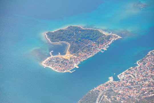 Krapanj island in the Adriatic Sea in Croatia . Flying over the island
