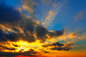 Naklejka na ściany i meble Sunset sky background with tiny clouds