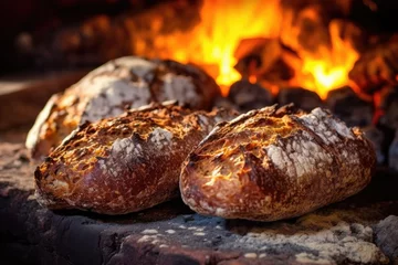 Zelfklevend Fotobehang close-up of crispy artisan bread in stone oven © Natalia