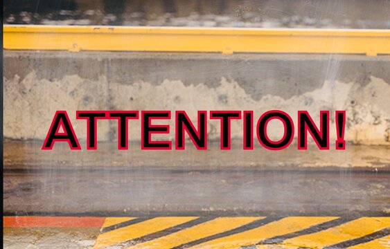 Attention concept written on roadway