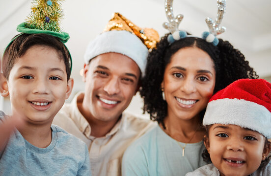 Parents, children and christmas selfie with smile, family home and excited for event, culture and celebration. Mother, father and young kids with xmas memory, photography and profile picture for blog