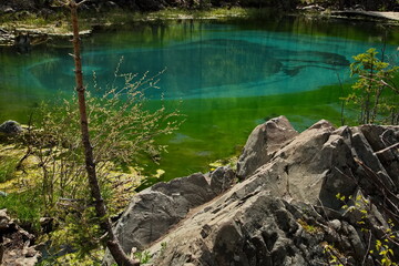Geyser lake near Aktash village in Altai.