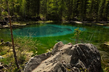 Geyser lake near Aktash village in Altai.