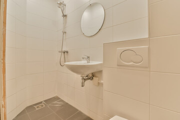a bathroom with a sink, mirror and toilet paper dispensed on the wall next to the shower